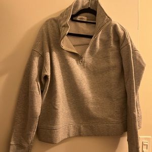 SoulCycle quarter zip with reflective logo around neck. Size large.
